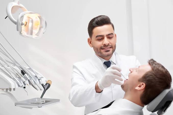 A professional feature image illustrating the sale of a dental practice in Canada, comparing share sales and asset sales while highlighting tax planning, due diligence, practice valuation, contracts, and the lifetime capital gains exemption.